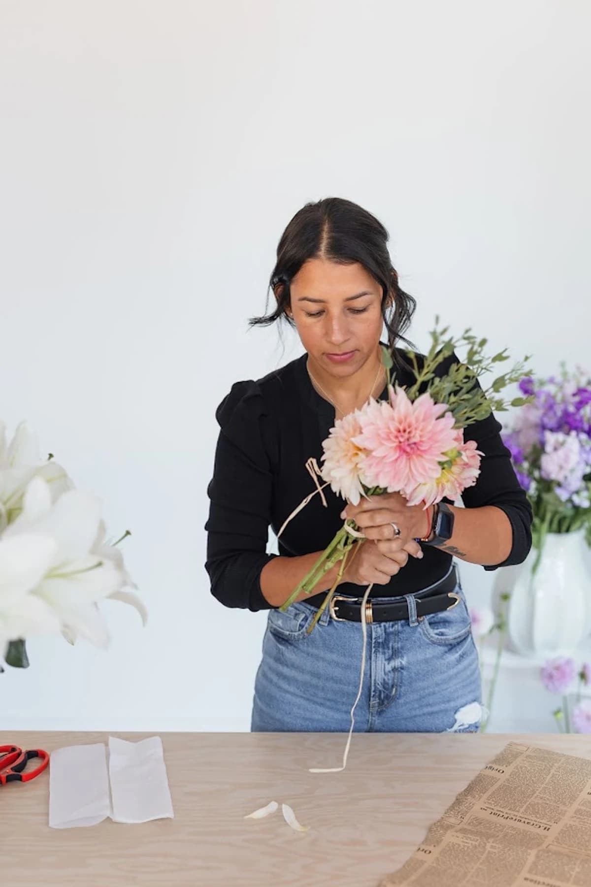 Celenia arranging flowers at her studio