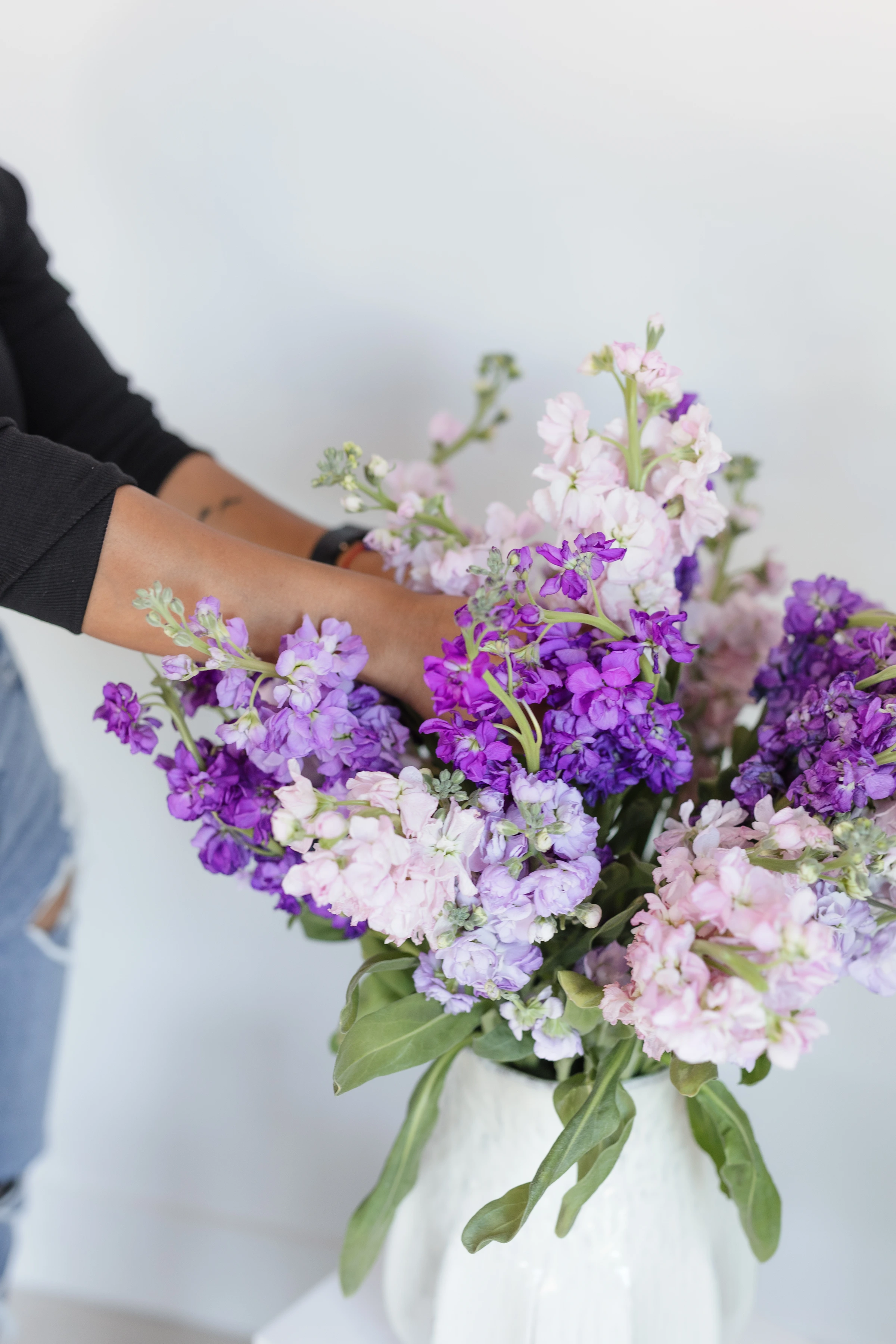 Celenia arranging a bouquet at her Bristow studio