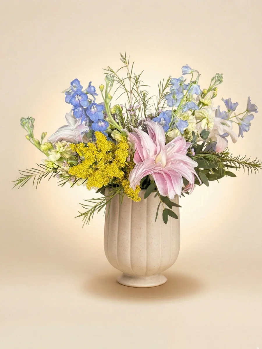 The Isabelle - cheerful petite arrangement with pink lily, blue delphinium, and golden solidago